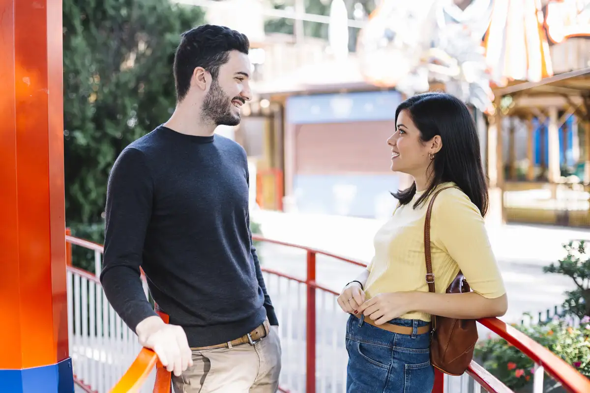 couple talking in theme park
