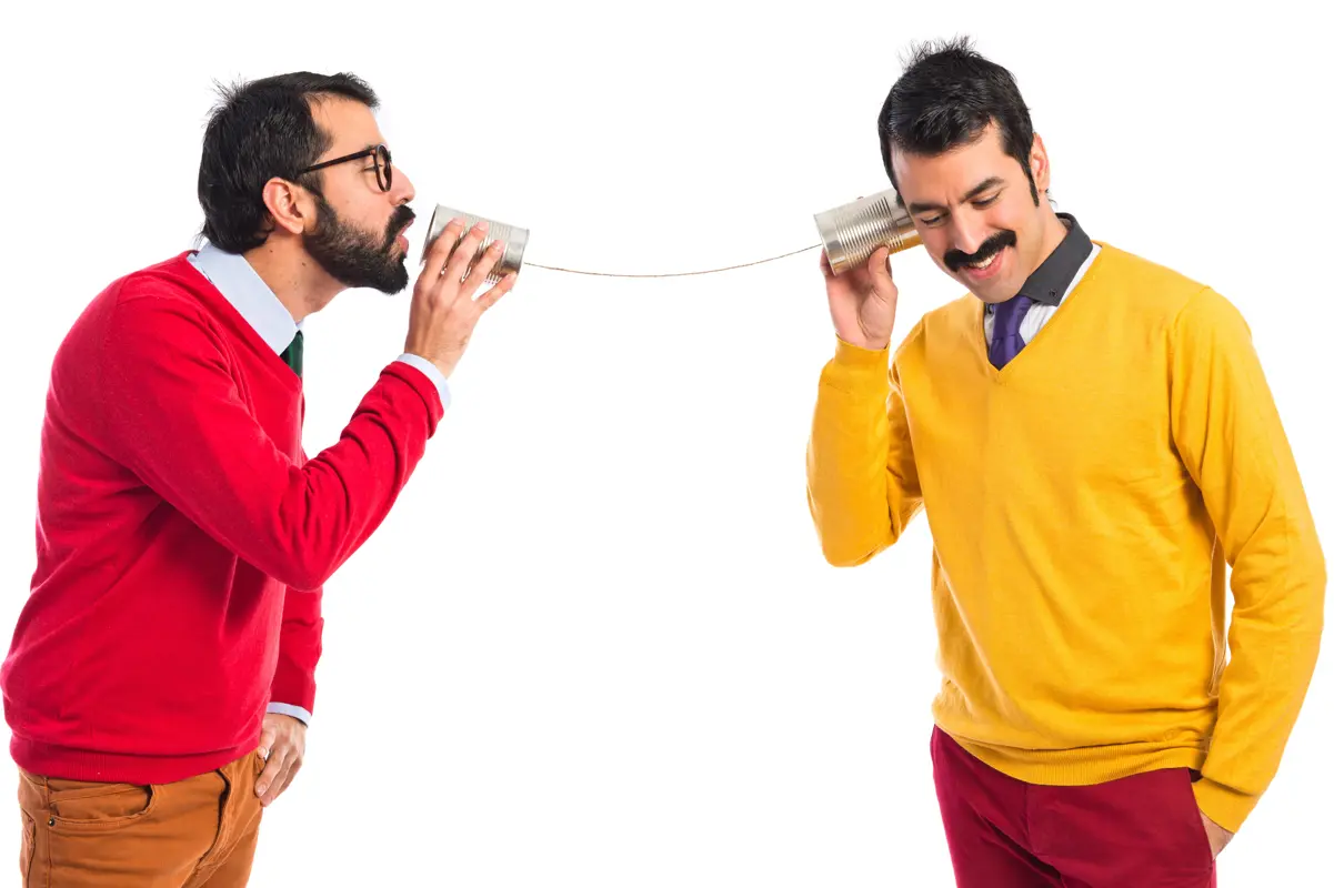 twin brothers talking through a tin phone