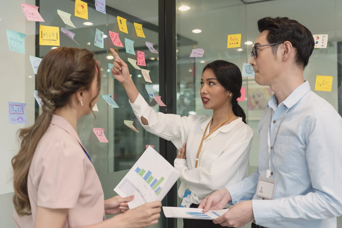 business asian people meeting office use post it notes to planning pr stunt