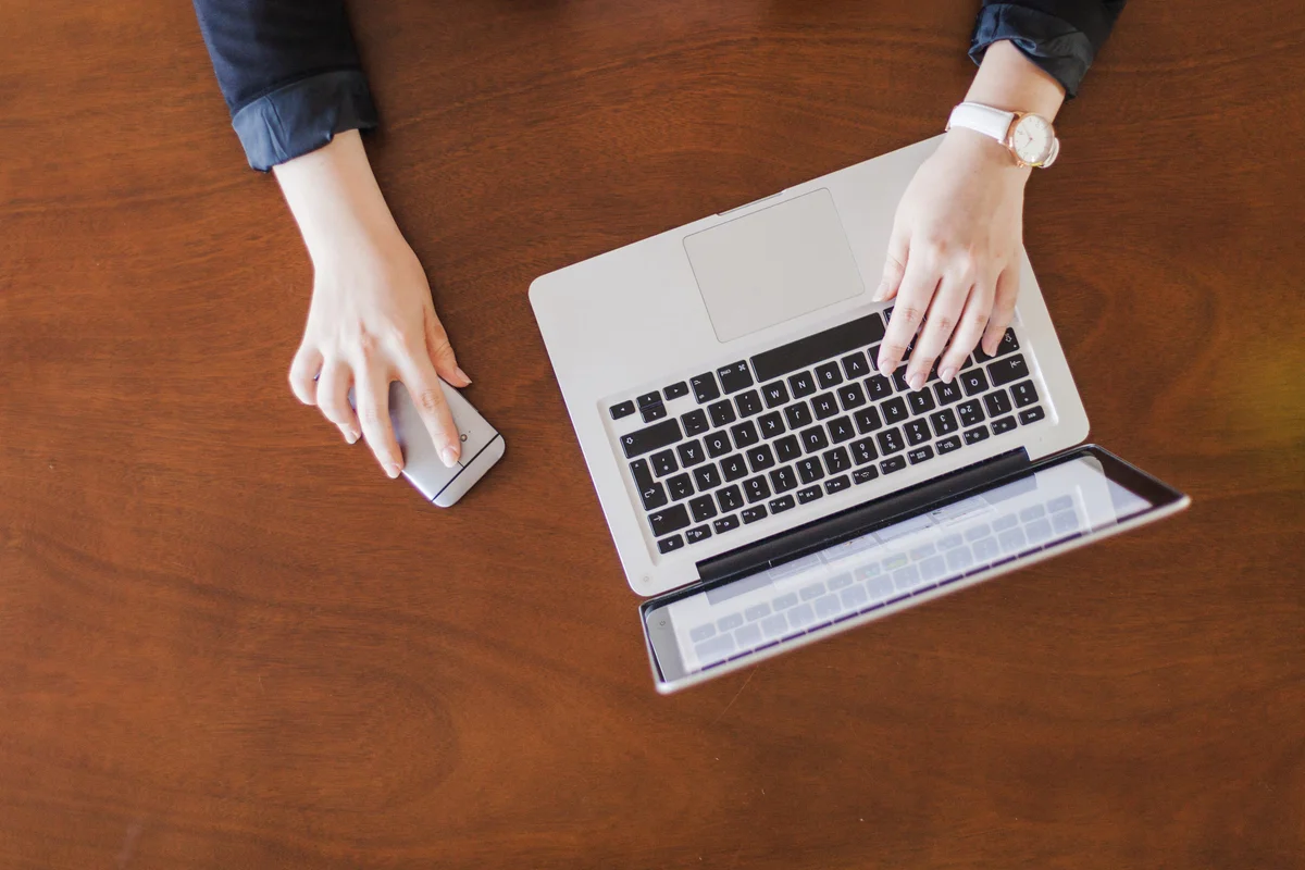 woman with smartphone laptop