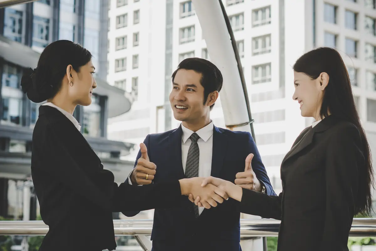 people in business handshaking